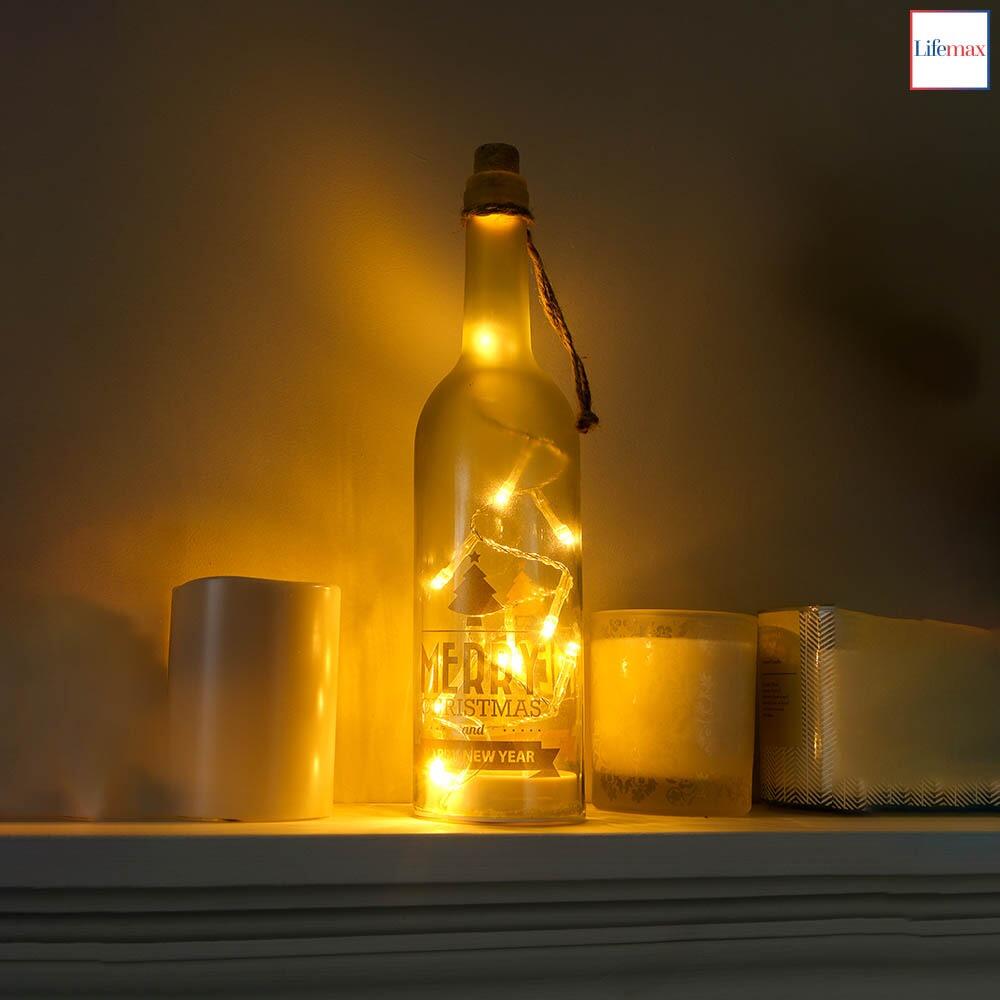 Lifemax Sparkling LED Christmas Wine Bottle Decoration on a mantle piece