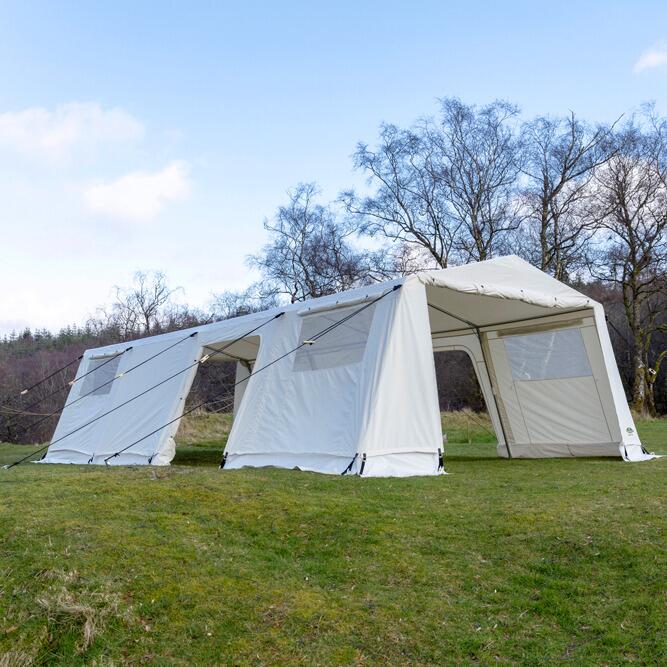 White bungalow 5 mess tent pitched on grass