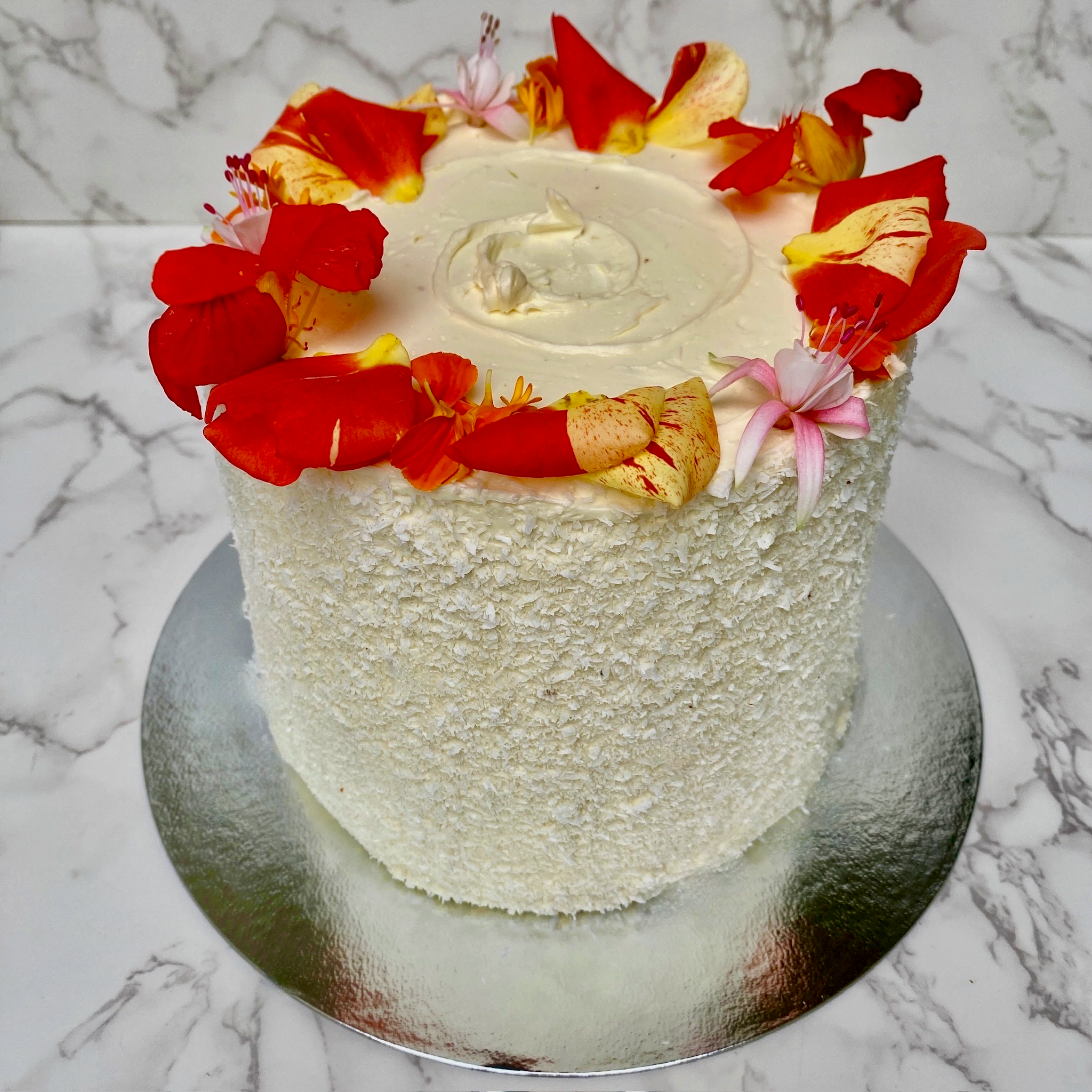 Coconut mango cake slice showing passion fruit curd filling