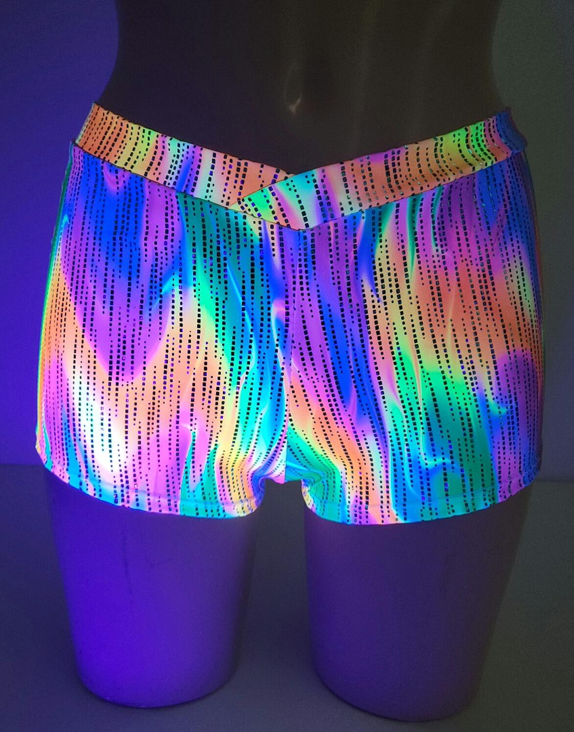 UV Hot pants, mulitcoloured pyscadellic design light under neon lights