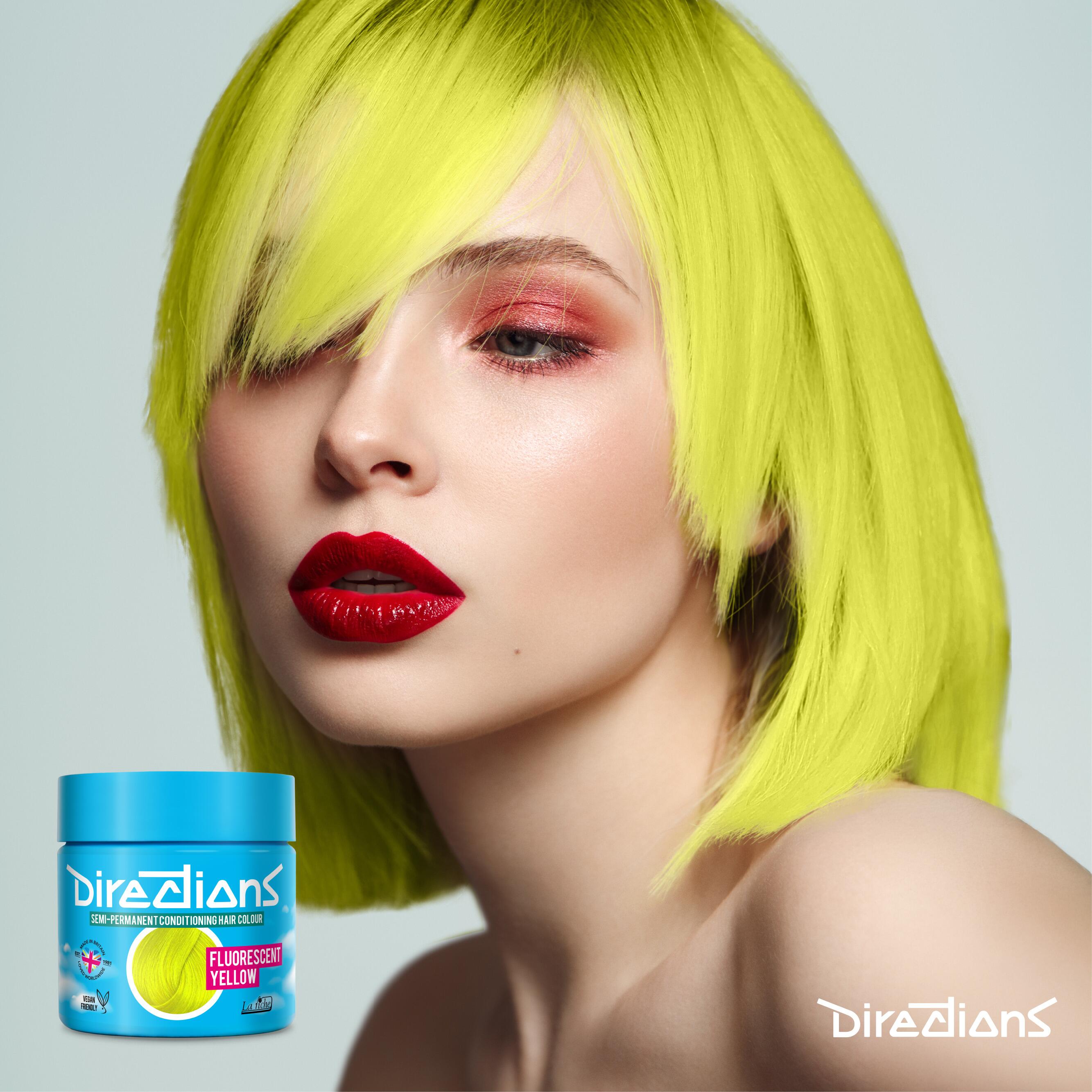 Fluorescent yellow directions hair dye colour on a model with long hair