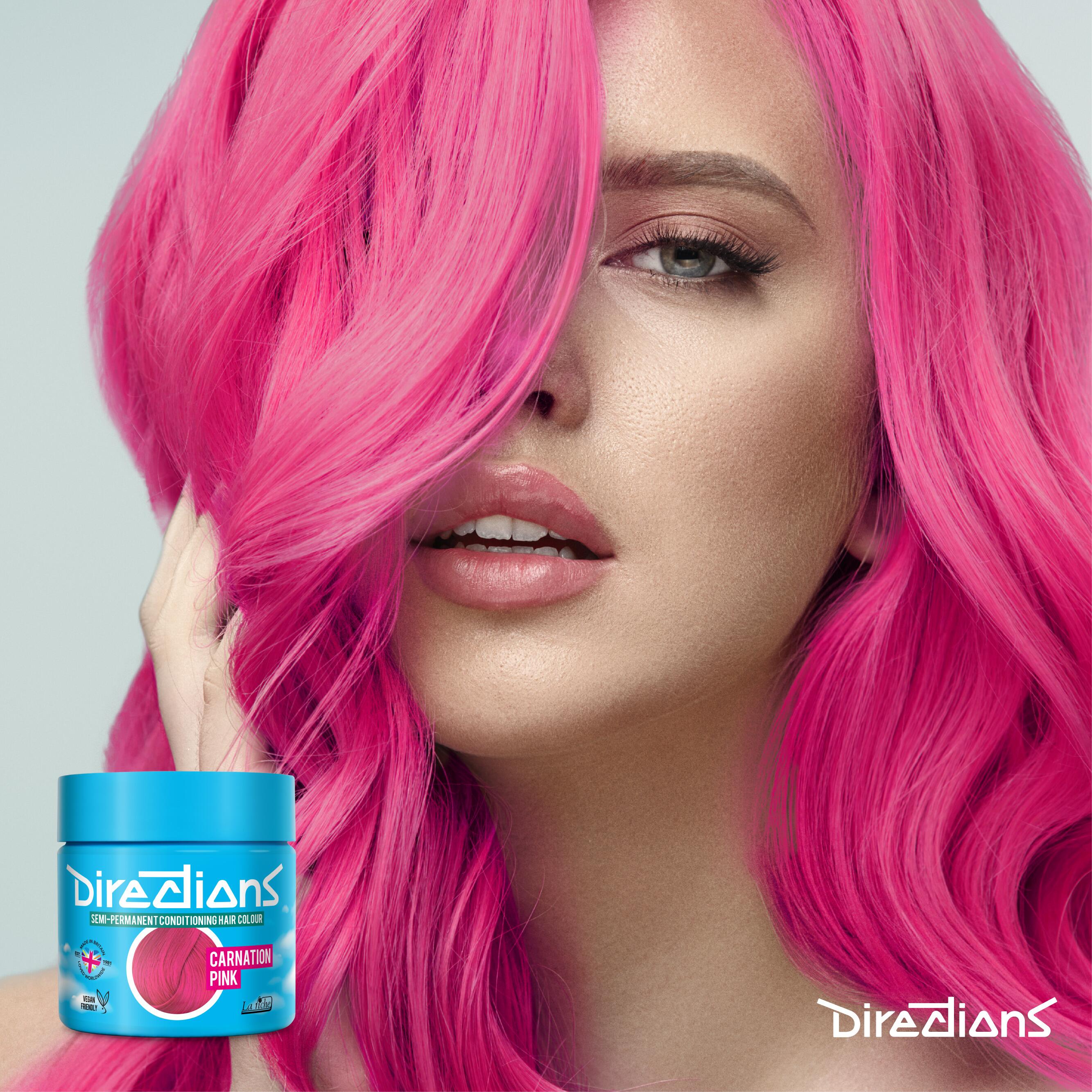 Carnation pink directions hair dye colour on a model with long hair