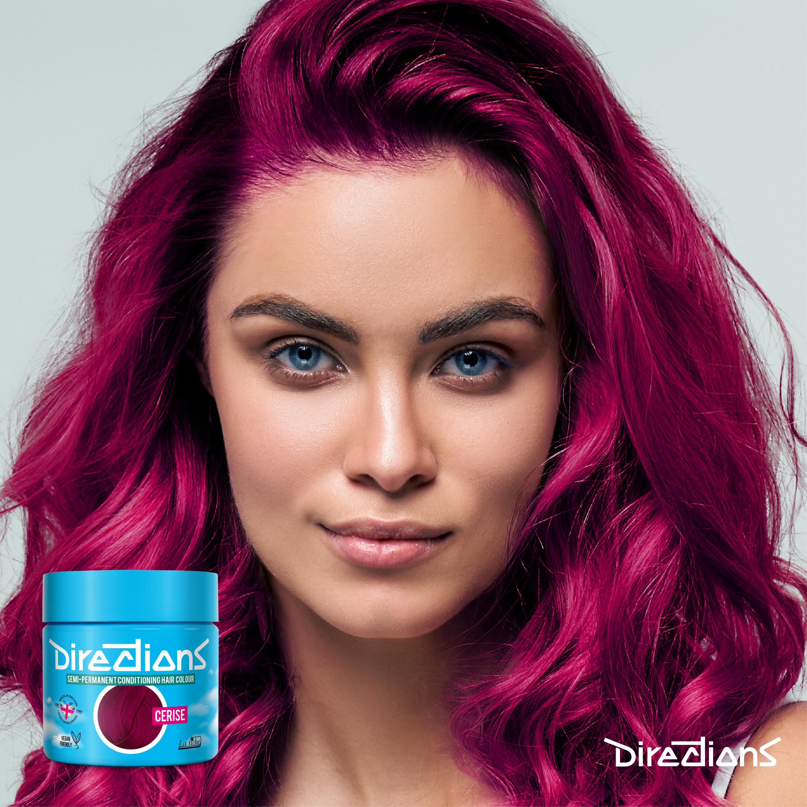 Cerise directions hair dye colour on a model with long hair