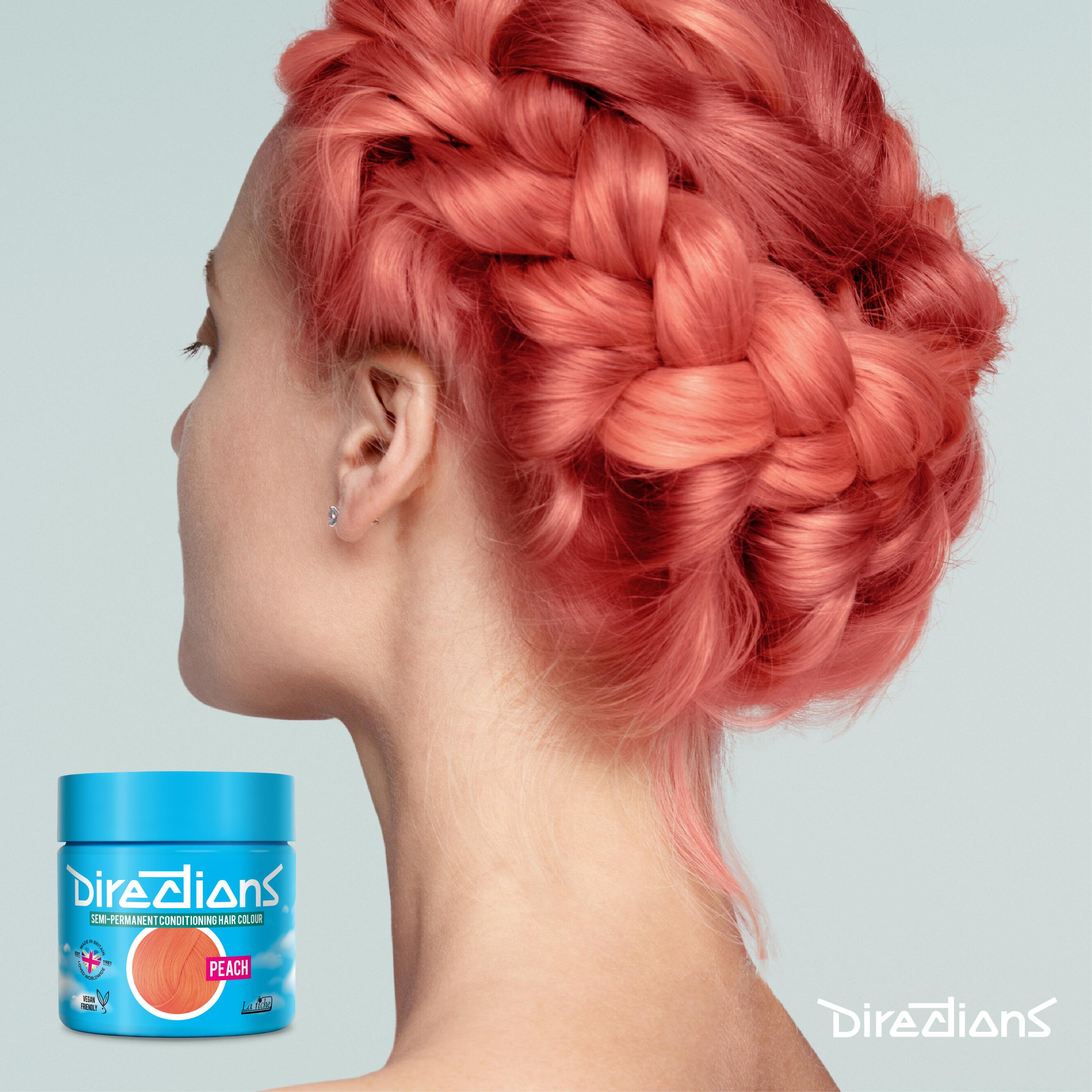 Peach directions hair dye colour on a model with long platted hair