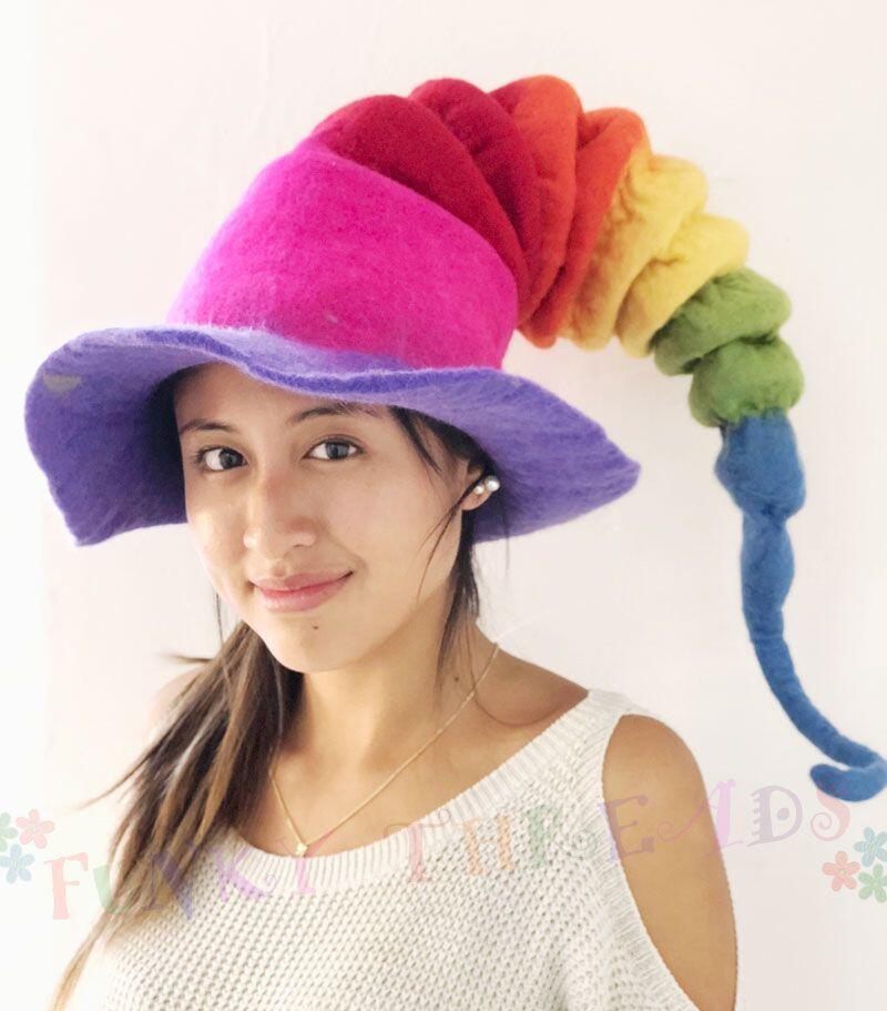 Lady wear a bright rainbow coloured felt hat