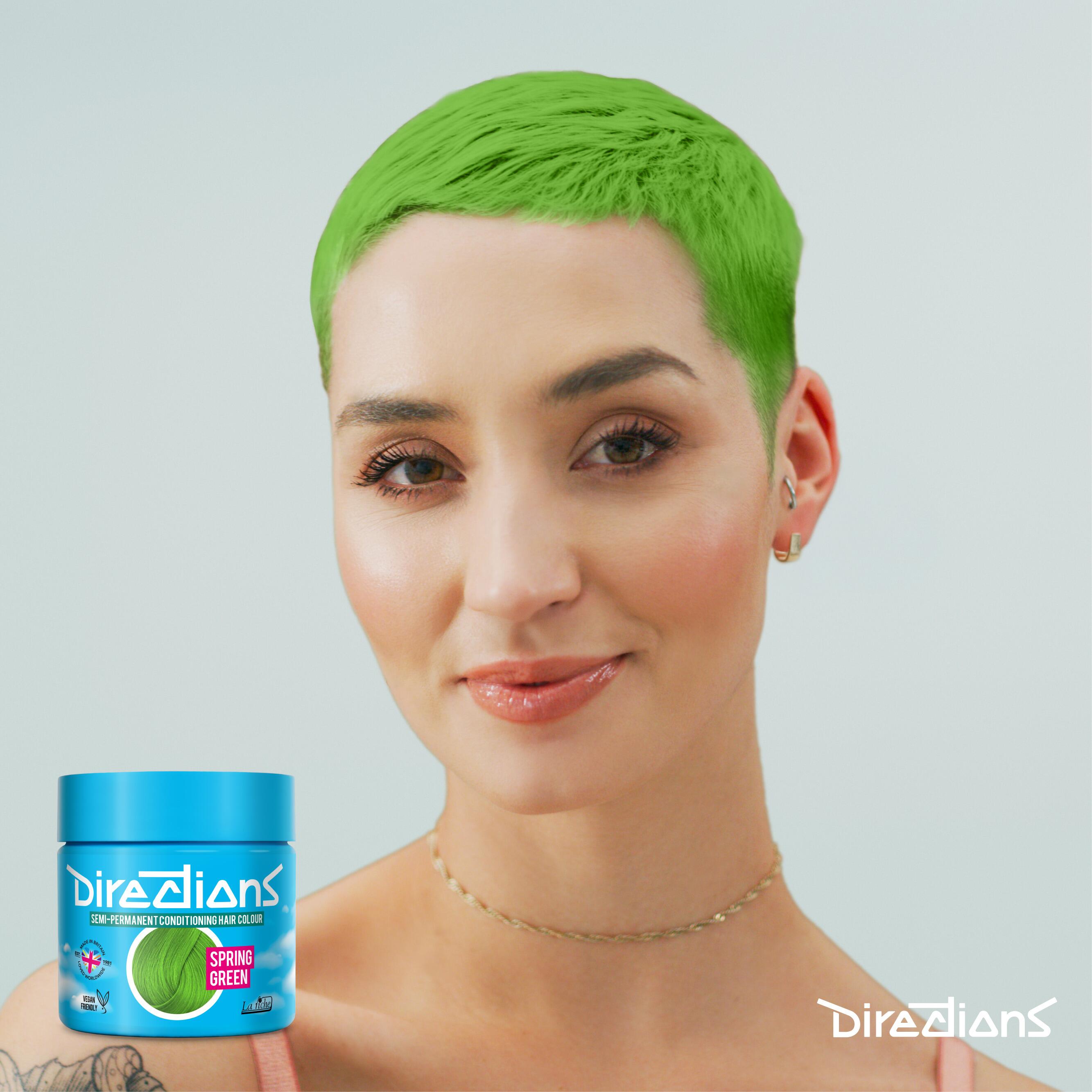 Spring green directions hair dye colour on a model with long hair