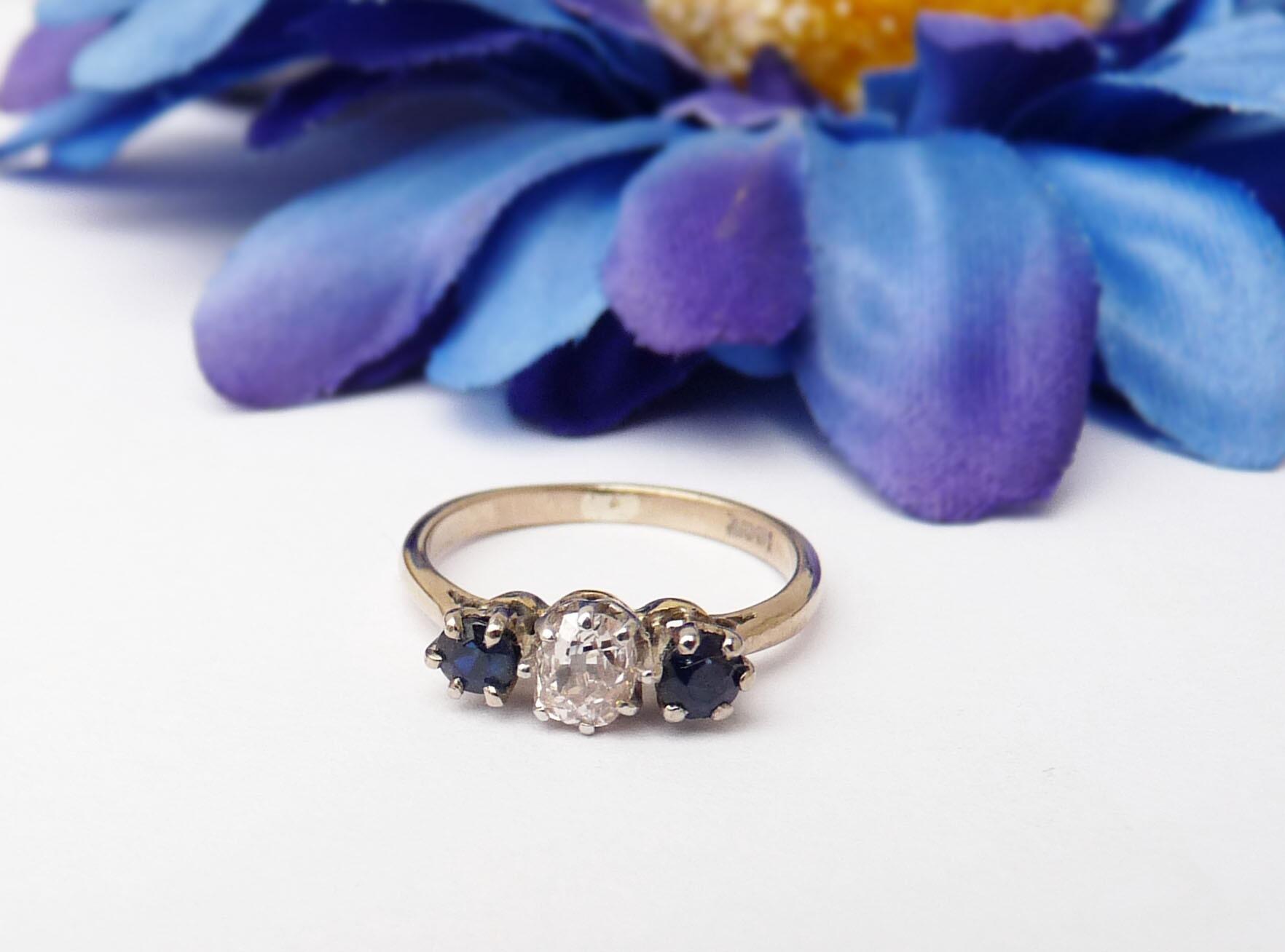 Platinum Sapphire And Diamond Three Stone Halo Dress Ring