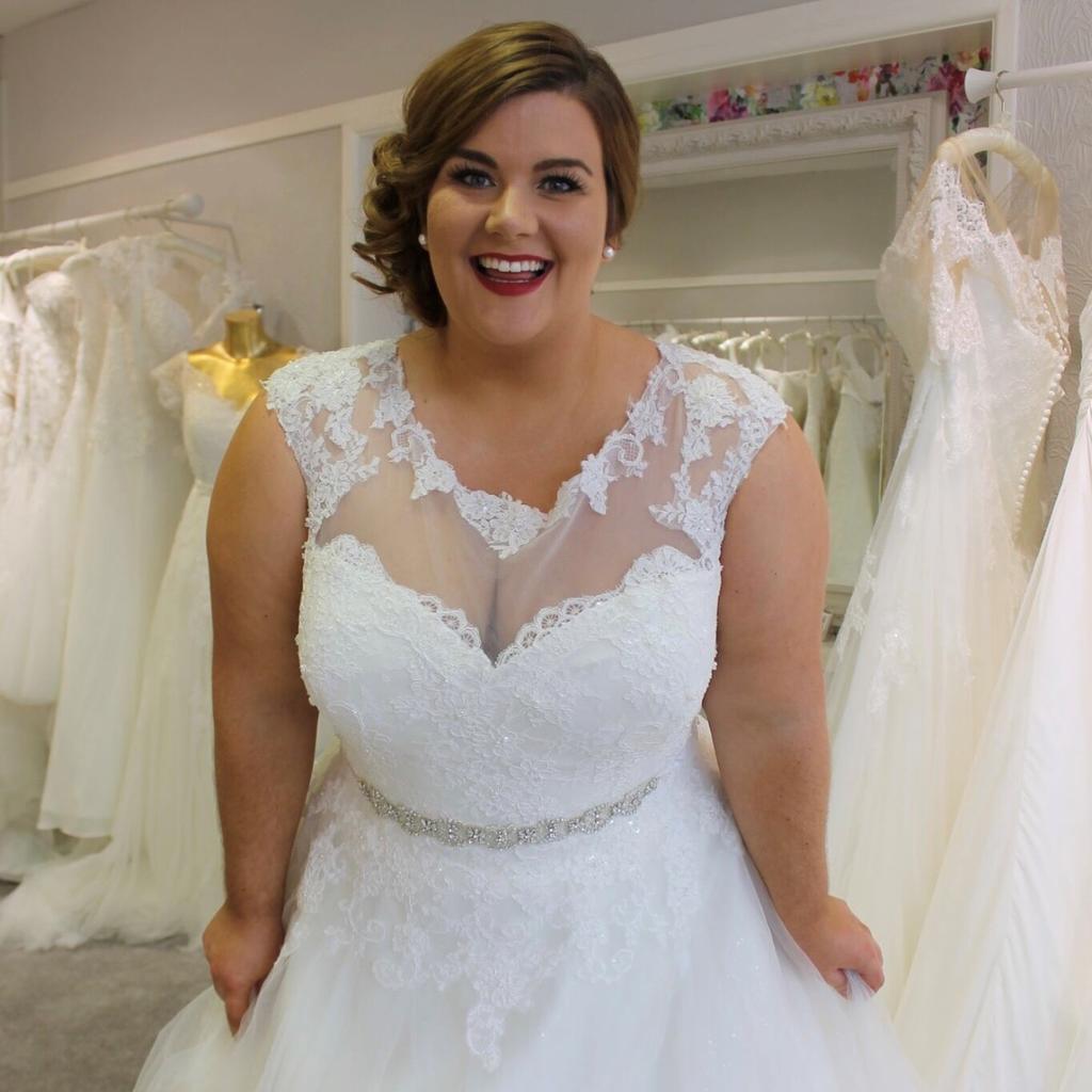 What Wedding Dress Style Best Suits A Plus Size Bride Who Doesn’t Like The Tops Of Their Arms?