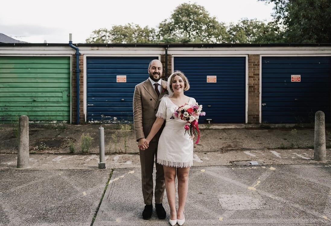 real bride wearing stunning 1960s inspired ivory silk bridal mini dress made by Dig For Victory