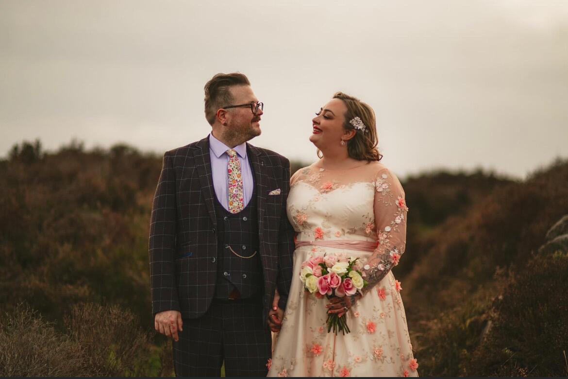 beautiful plus size bride wearing bespoke Dig For Victory wedding dress made from blush pink and gold 3D floral lace