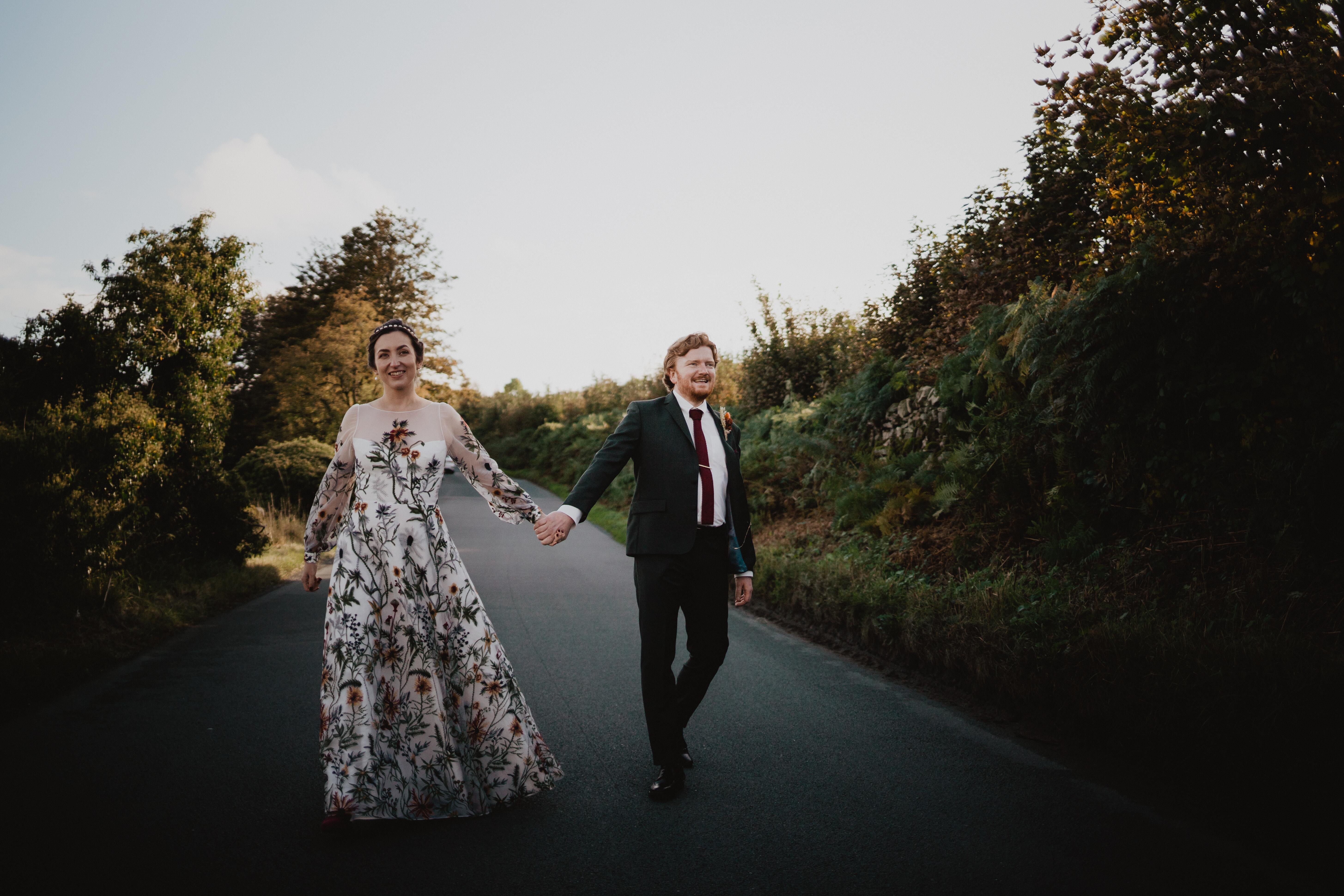 stunning real bride wearing bespoke full length wedding dress made from unique autumnal coloured floral lace