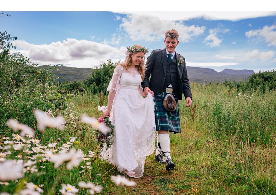 beautiful real bride walking through meadow wearing bespoke 3D lace wedding dress made by Dig For Victory