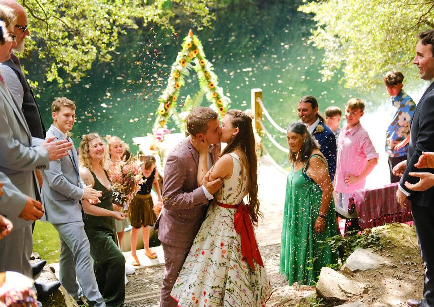 beautiful real life bride wearing colourful botanical lace wedding dress at glorious outdoor wedding
