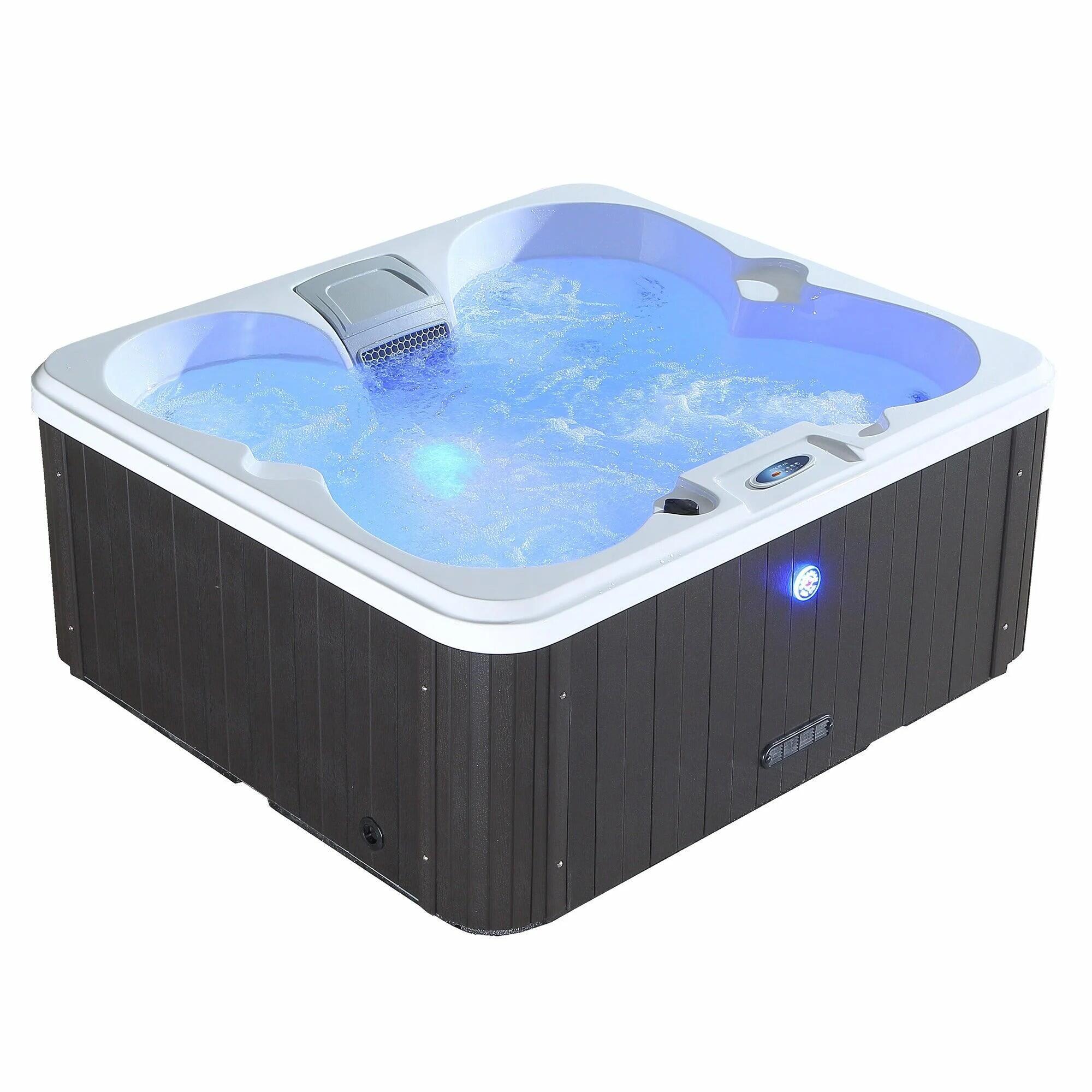 Garden hot tub setup with privacy screening and outdoor lighting