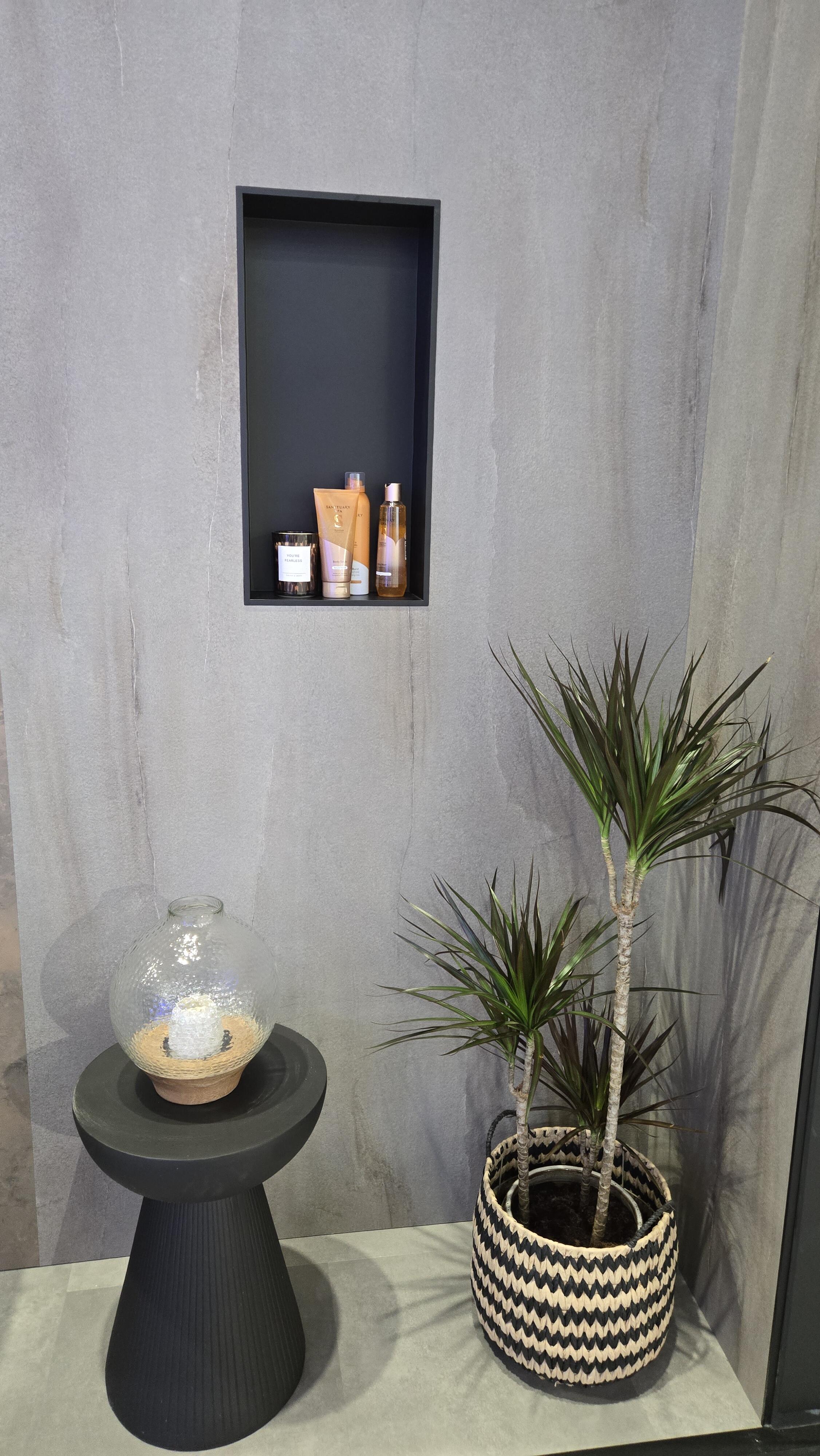 Cool grey bathroom with chrome fixtures showing dated 2010s style