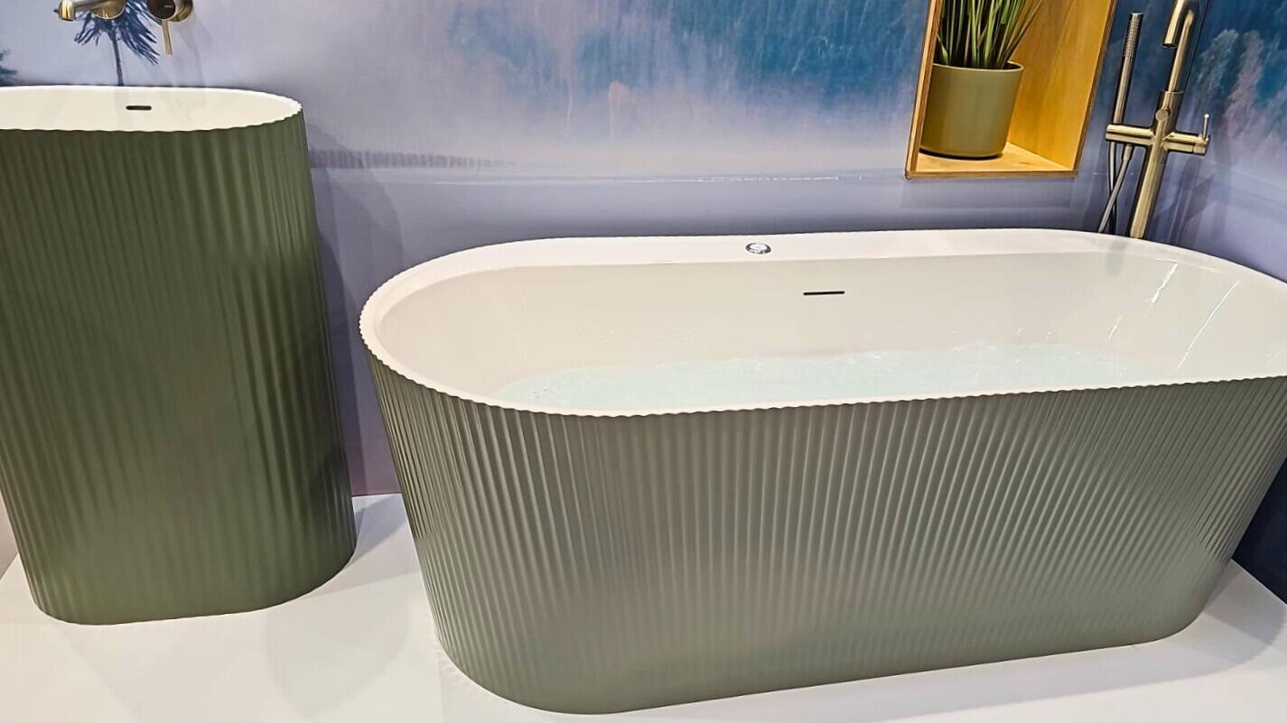 Calm bathroom vignette with towels, candles and spa-style accessories