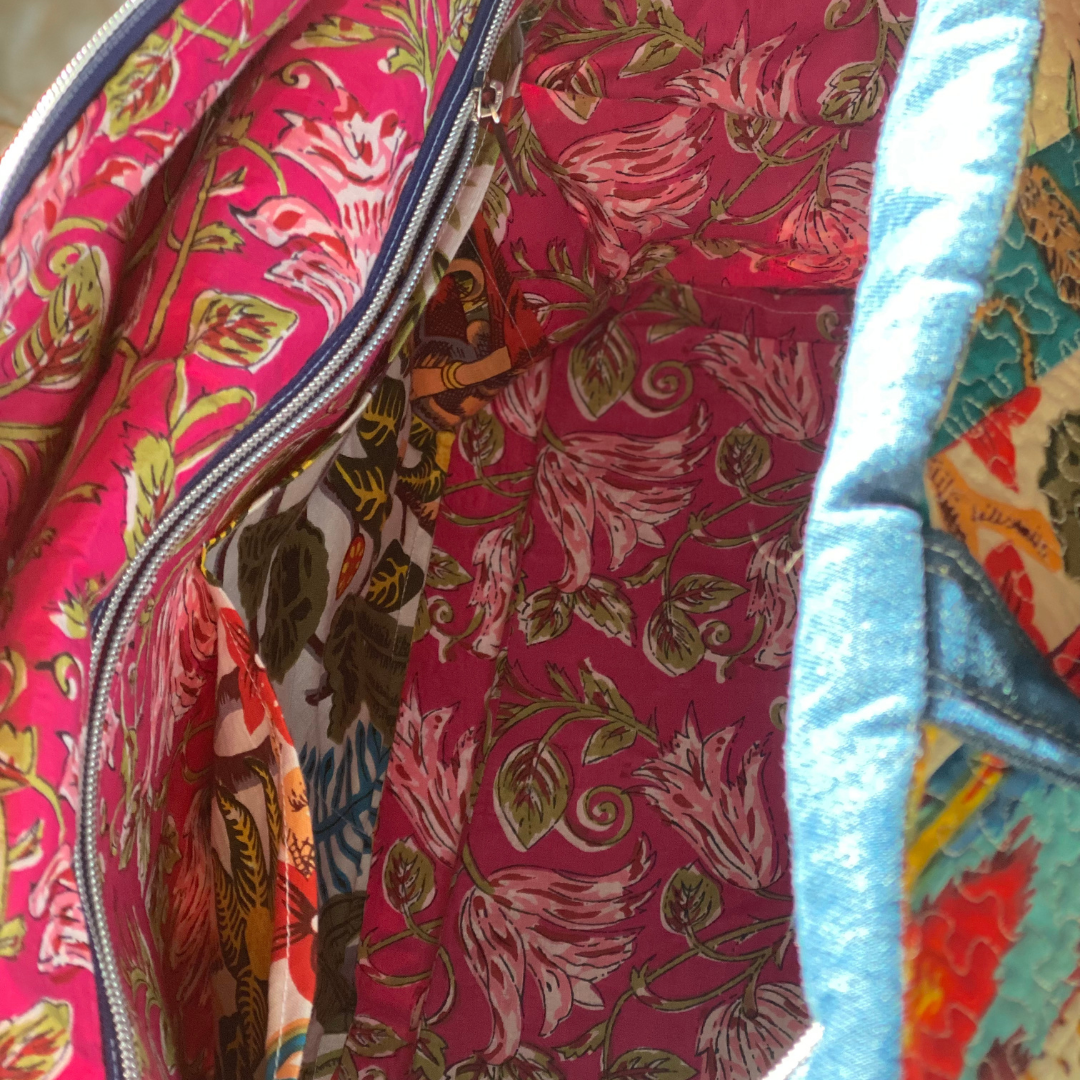 Interior of patchwork flight bag, showing lap top pocket
