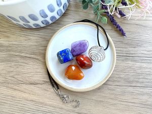 Personal Power crystal cage pendant set with four tumbled stones by the holistic hamper