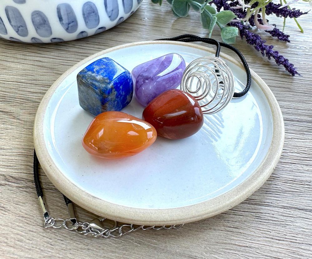 Personal Power crystal cage pendant set with four tumbled stones by the holistic hamper