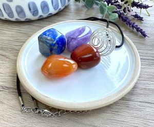 Personal Power crystal cage pendant set with four tumbled stones by the holistic hamper