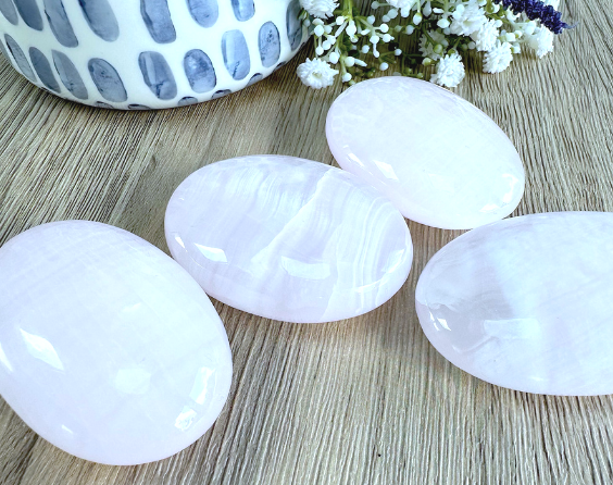 four genuine pink Mangano calcite quality palm stones