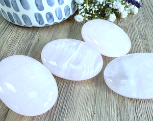 four genuine pink Mangano calcite quality palm stones