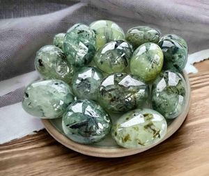 large prehnite green tumble stones with black tourmaline inclusions