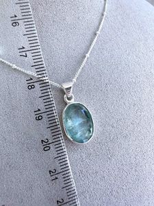 green kyanite oval sterling silver pendant with optional chain showing ruler for size