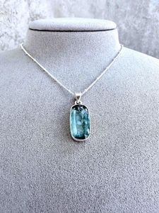 green kyanite rectangular crystal pendant on sterling silver on display bust with optional chain