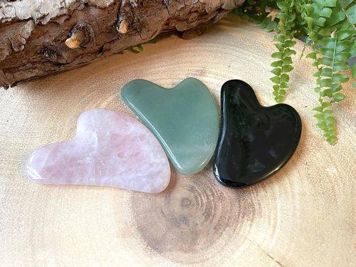 group of crystal Gua sha in aventurine, black obsidian and rose quartz