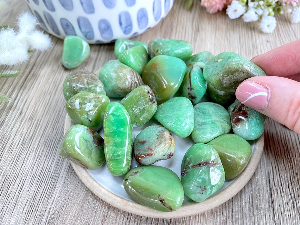 green chrysoprase crystal tumble stones on a dish