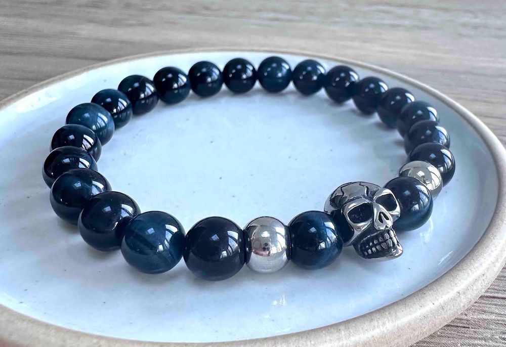 Blue tigers eye crystal mens bracelet in 8mm gemstone beads on a dish
