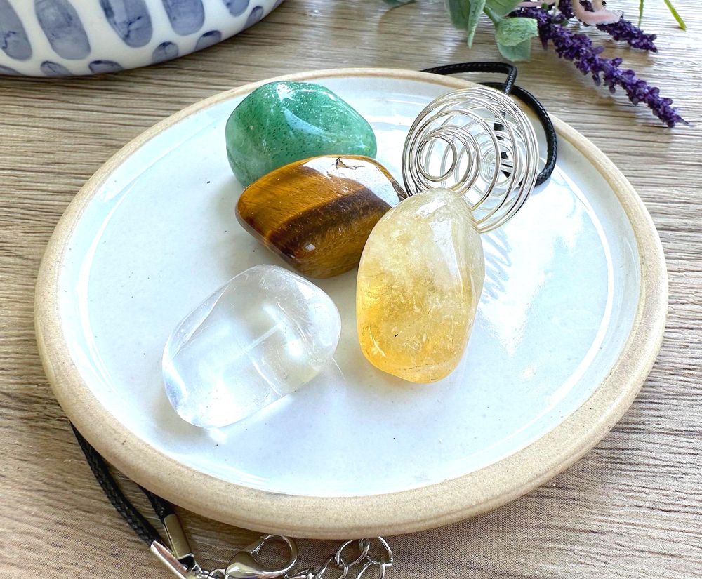 Manifestation crystal cage necklace set with four tumble stones from the holistic hamper crystal shop