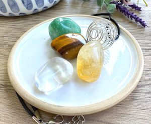 Manifestation crystal cage necklace set with four tumble stones from the holistic hamper crystal shop