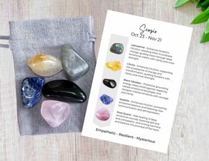scorpio crystals set with five tumbled stones and a grey cotton gift bag ad properties card