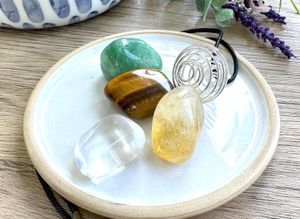 Manifestation crystal cage necklace set with four tumble stones from the holistic hamper crystal shop