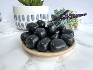 shungite black tumble stones on a plate, the holistic hamper crystals online shop UK