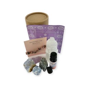 inner peace and relaxation pamper pot with a selenite tower, rhodonite bracelet, four rough crystals, essential oil blend and a lava tumble