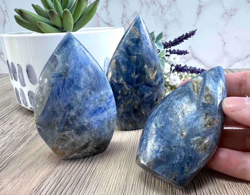 three blue kyanite smooth points