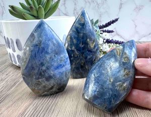 three blue kyanite smooth points