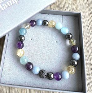 aquarius crystal bracelet in grey bracelet box with hematite, citrine, angelite, aquamarine and amethyst