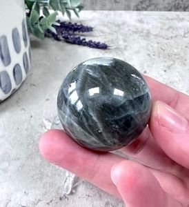 labradorite small crystal sphere in hand
