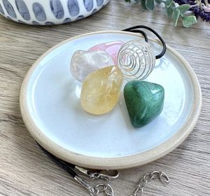Good vibes self love crystal set with four tumble stones and a wire pendant necklace