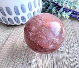 Fire quartz crystal sphere on stand
