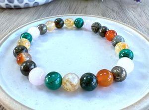 Fibromyalgia chronic illness crystal bracelet in oranges, greens and golds