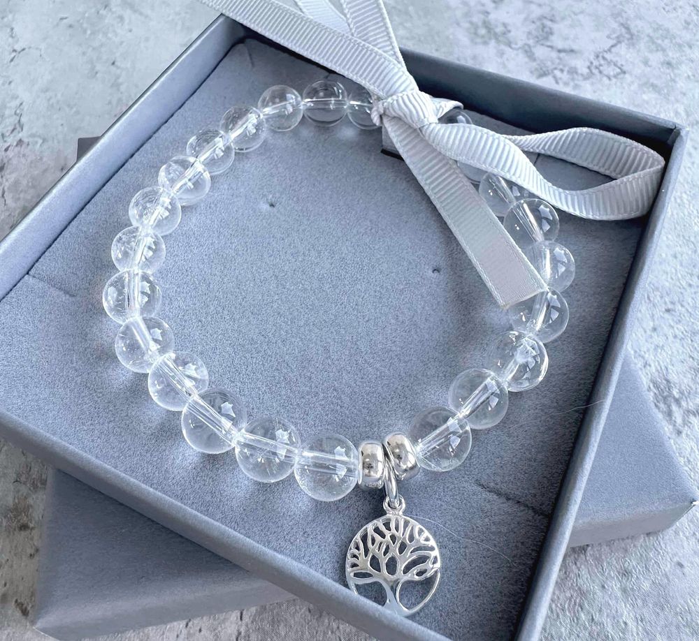 Clear quartz crystal charm bracelet with sterling silver tree of life charm in branded box