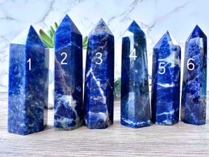 six Sodalite crystal towers blue with white and orange graining
