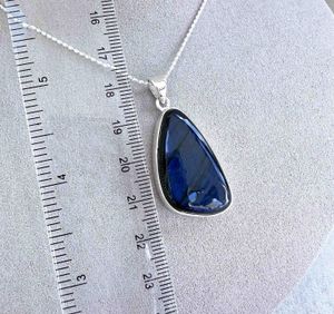 blue flash labradorite freeform sterling silver crystal pendant on optional chain with ruler to show sizing