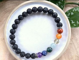 7 Chakra Balancing Crystal Gemstone Bracelet on a dish with diffuser lava beads
