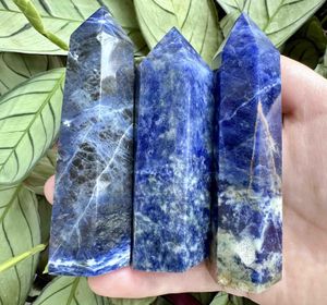 six Sodalite crystal towers blue with white and orange graining